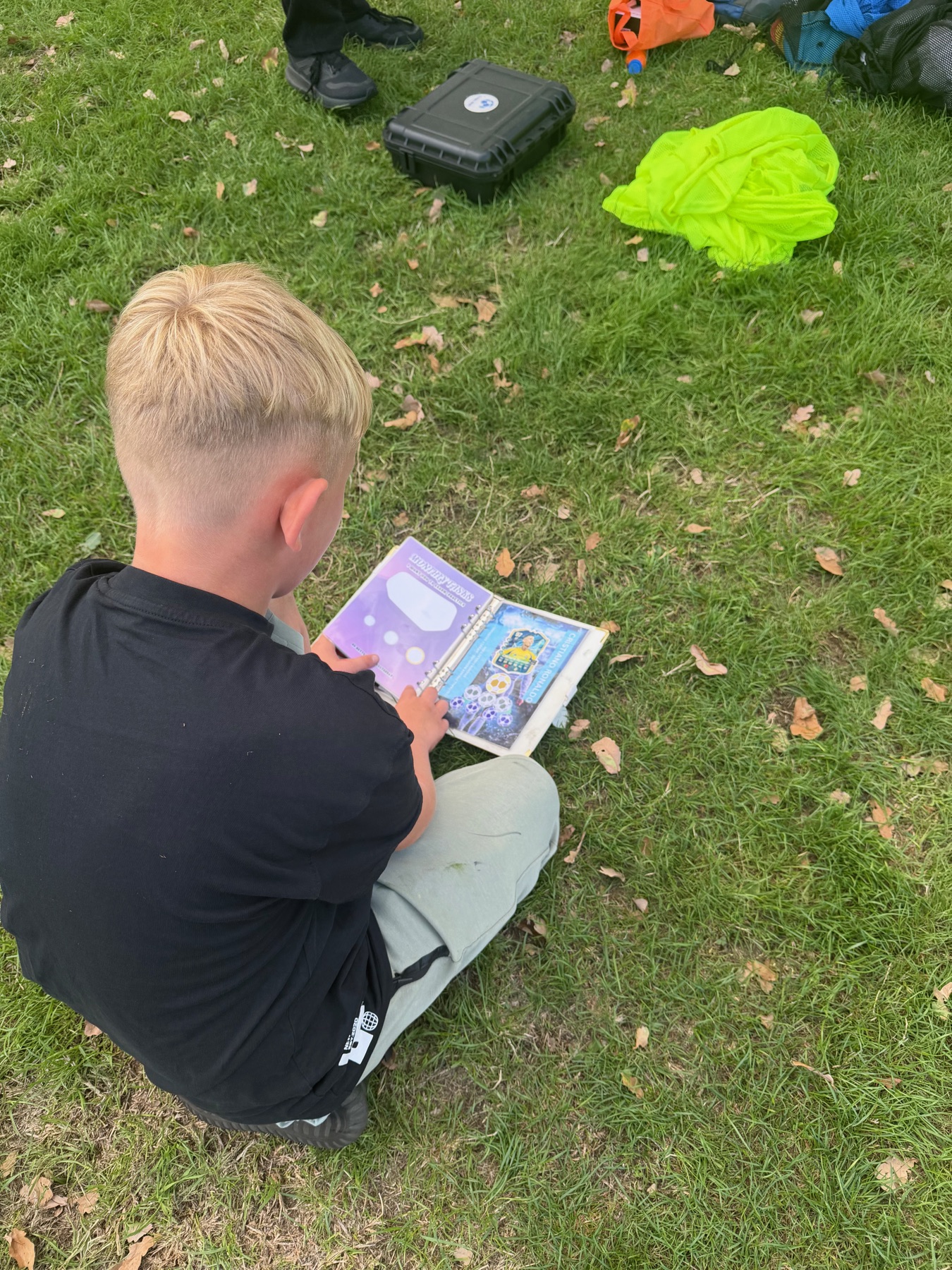 Child holding a Football Frenzy Book